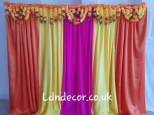 Colourful mehndi backdrop with garland london